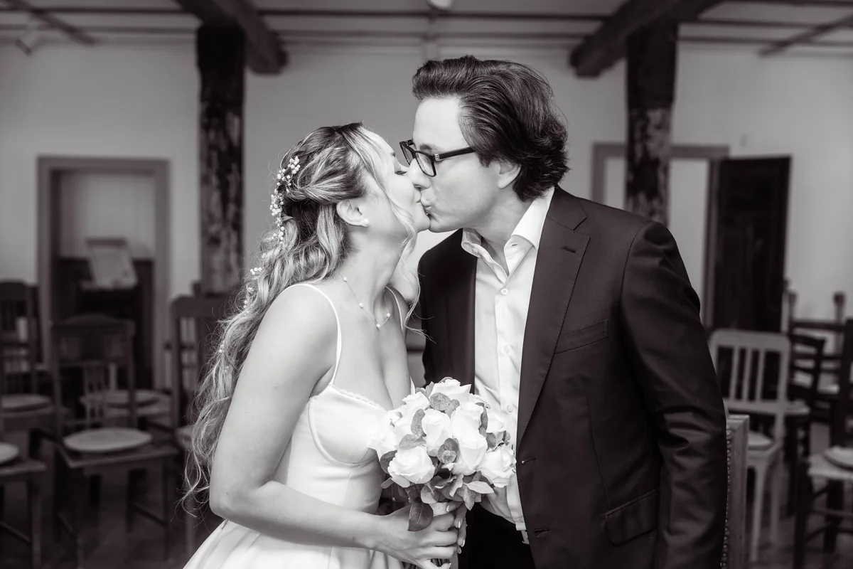Wedding couple kissing in black and white