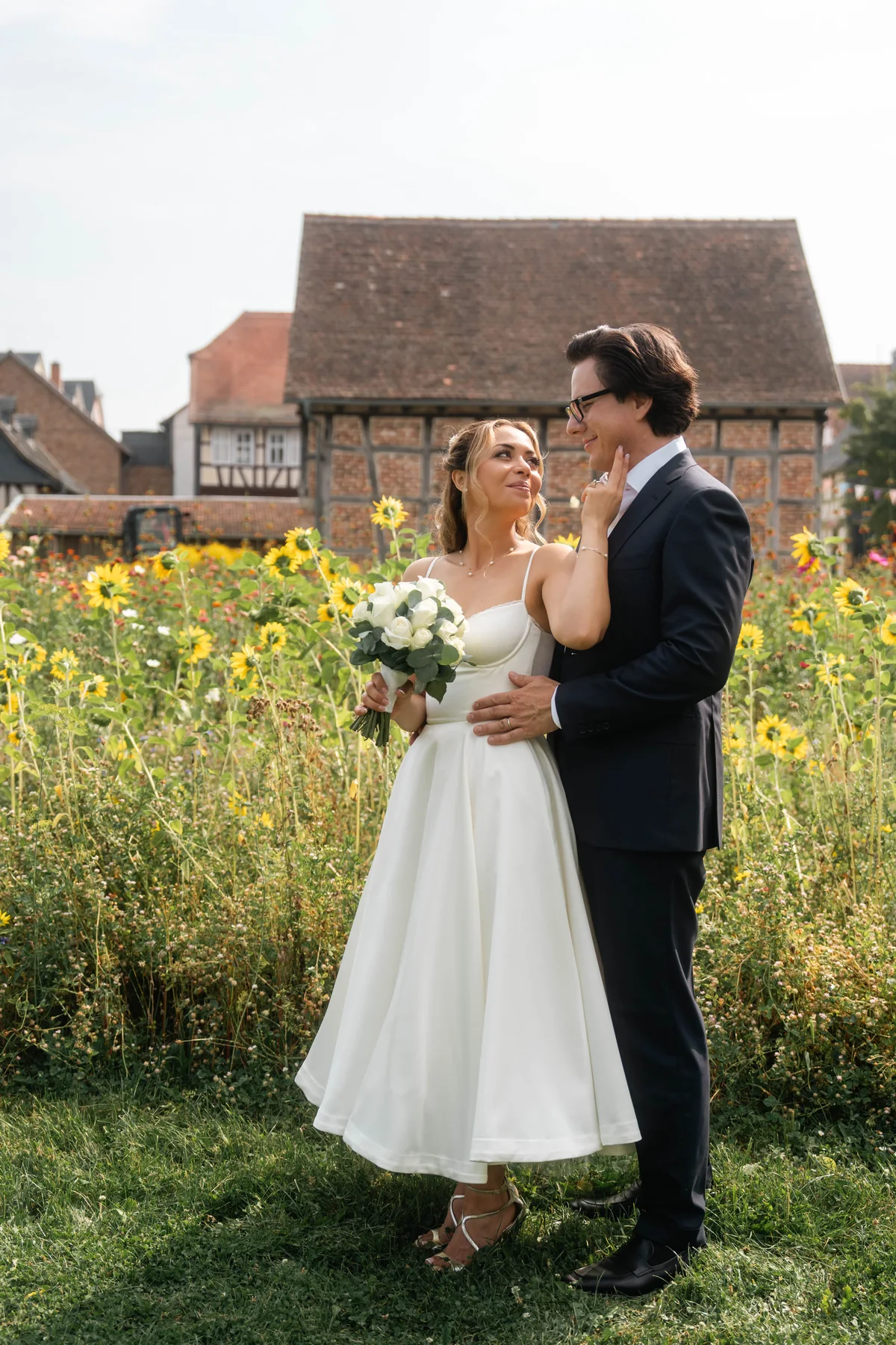 Wedding couple among wildflowers